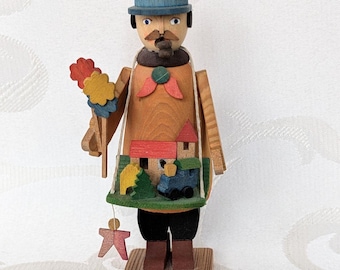 Miniature incense smoker from the Erzgebirge region, made by a toymaker, featuring a village and railway motif. Vintage wooden incense figure, handmade, approx. 11 cm.