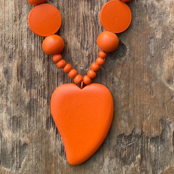 Long wooden beaded orange necklace with focal pendant heart