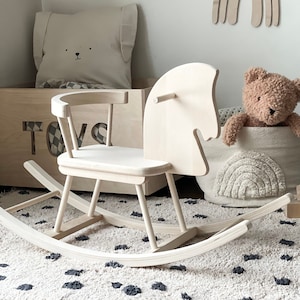 Wooden rocking horse can be personalised. It is the perfect swing-toy to develop fine and gross motor skills.