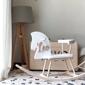 Personalised Wooden Rocking Horse painted in white colour. Safe for all ages 18 month and up. Features a comfortable riding seat that will make your child have a feel of thrilling riding and have long hours of fun.