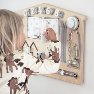 Busy board is individually hand-crafted from high quality Birch Plywood and is also painted with child-safe non-toxic paint. Each busy board can be personalised!