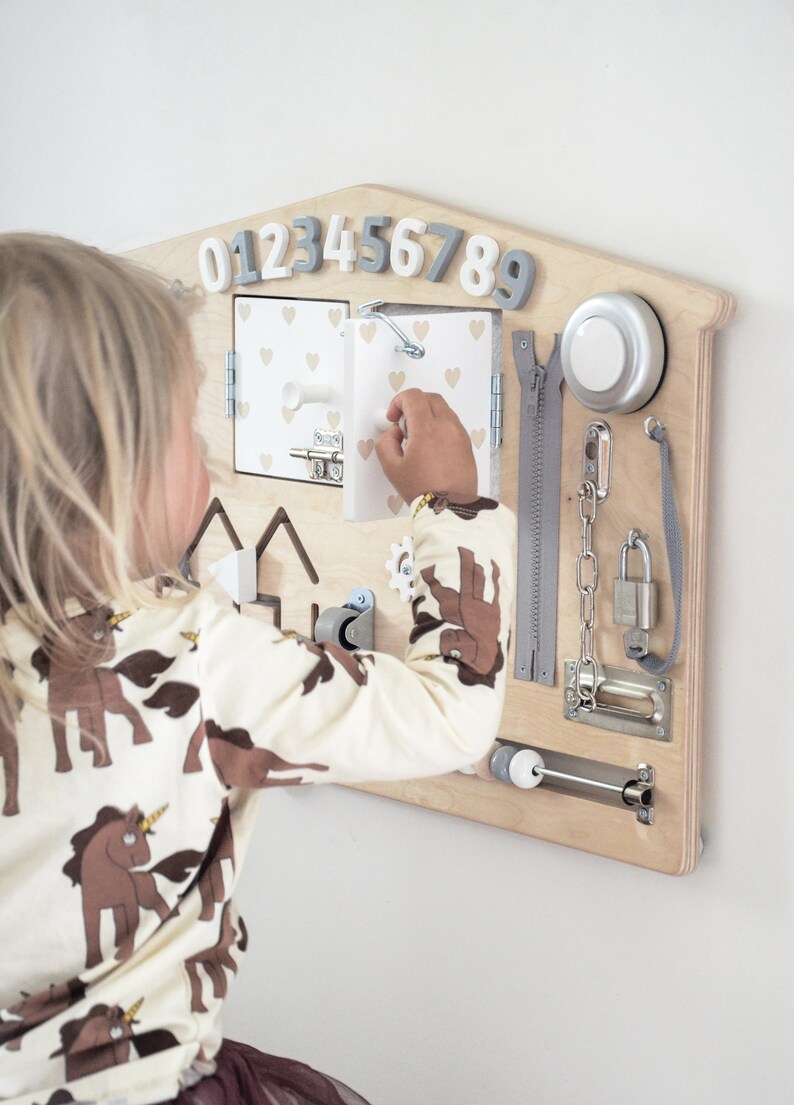 Busy board is individually hand-crafted from high quality Birch Plywood and is also painted with child-safe non-toxic paint. Each busy board can be personalised!