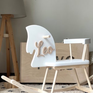 Personalised Wooden Rocking Horse painted in white colour. Safe for all ages 18 month and up. Features a comfortable riding seat that will make your child have a feel of thrilling riding and have long hours of fun.