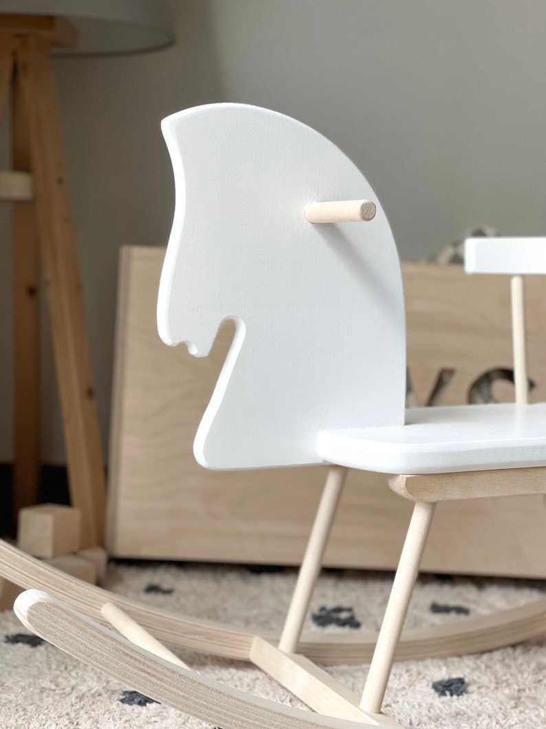 Personalised Wooden Rocking Horse painted in white colour - the perfect swing-toy to develop fine and gross motor skills.