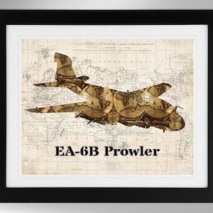 May include: A vintage-style print of an EA-6B Prowler aircraft silhouette, overlaid on an antique world map. The aircraft is made up of various map details, creating a unique and intricate design.