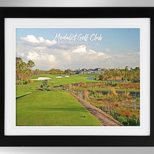 May include: A painting of a golf course with a green fairway, a pond, and a clubhouse in the background. The text "Medalist Golf Club - 18th Hole - Par 5 - 526 Yards -" is written on the image.