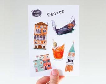 May include: A set of five watercolor stickers featuring iconic Venice imagery, including a gondola, a building with arches, a glass of Aperol Spritz, and a tall tower. The stickers are on a white background and have the text "Dolciatje Dreams" and "Venice" printed on them.