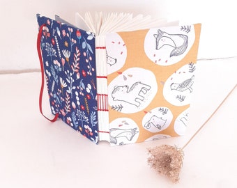 Handbound notebook, A6 notebook with elastic band and 200 dotted pages, handmade diary with little animals and flowers in blue and honey