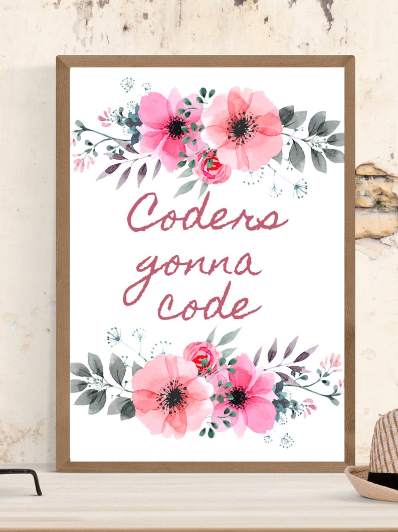Puede incluir: Una impresi&oacute;n enmarcada con un dise&ntilde;o floral y el texto "Coders gonna code". La obra de arte presenta flores rosas estilo acuarela, hojas verdes y un marco de madera. La est&eacute;tica general es suave y femenina.