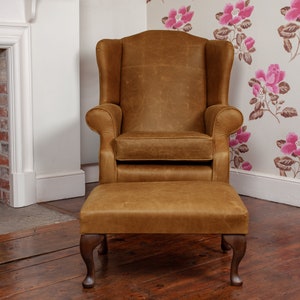 Chesterfield Wing Back Armchair And Foot Stool Presented In 100% Genuine Vintage Tan Leather Hand made in the UK