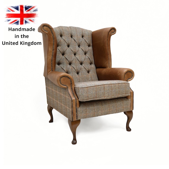 A Pair of Chesterfield Queen Anne Wing Back Chairs and Footstool