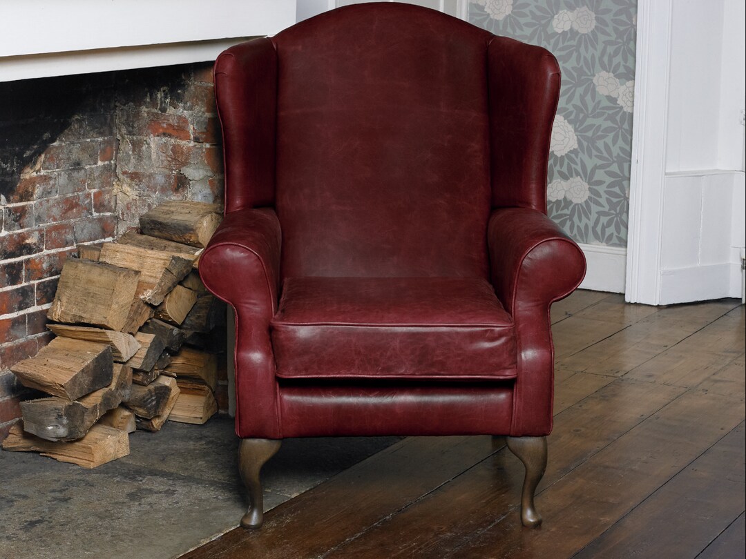 Chesterfield Wing Back Armchair Presented in Vintage Red 100 Leather