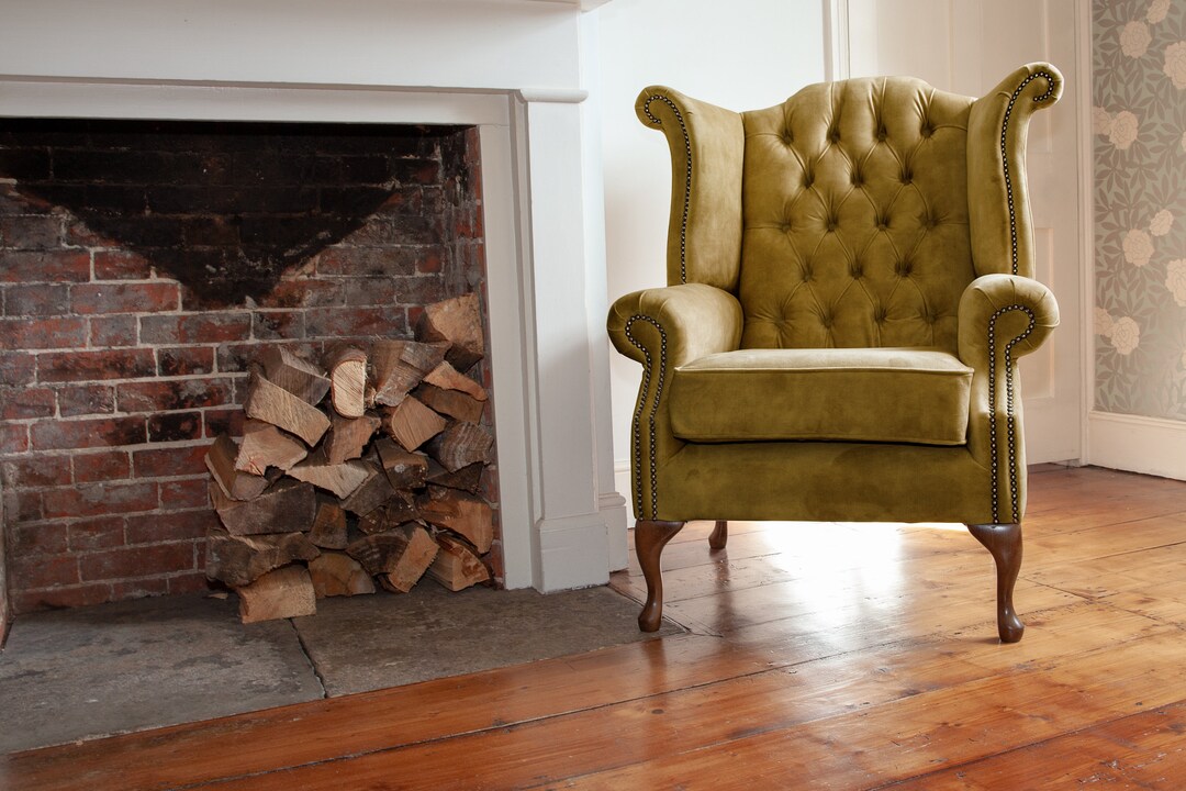 Chesterfield Queen Anne high back wing chair presented in vintage