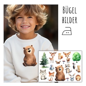 Könnte beinhalten: Bügelbilder mit niedlichen Waldtieren, darunter ein Bär, ein Reh, ein Fuchs, ein Waschbär und ein Igel. Die Bügelbilder sind perfekt, um Kleidung, Taschen oder anderen Stoffartikeln einen Hauch von Verspieltheit zu verleihen.