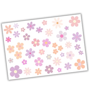 Può includere: Un foglio di adesivi di fiori colorati in rosa, viola e arancio. Gli adesivi sono di varie dimensioni e forme.
