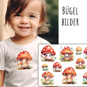 Op de afbeelding: Een wit T-shirt met een schattig cartoon-paddenstoelontwerp. Het shirt wordt gedragen door een kind. De afbeelding toont ook een vel met strijktransfers met meerdere paddenstoelontwerpen. De tekst "BÜGEL BILDER" is zichtbaar in de afbeelding.