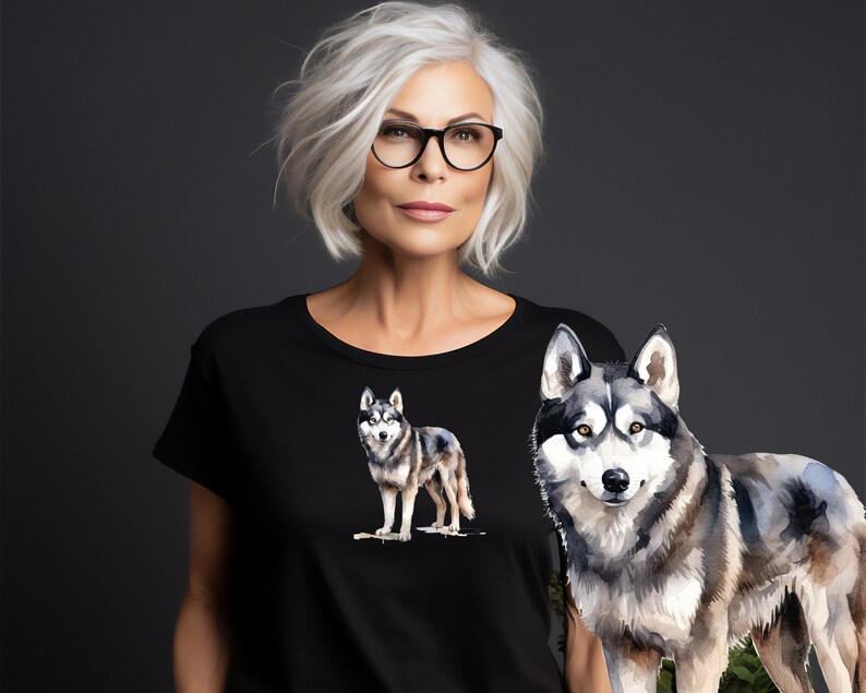 May include: A black t-shirt with a watercolor illustration of a wolf on the front. The wolf is gray and white with a black nose and eyes.