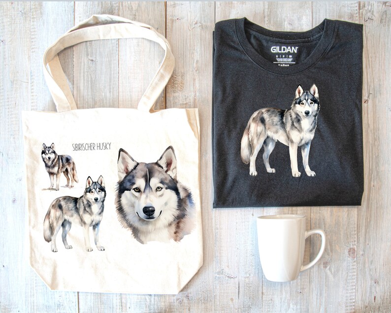 May include: A white tote bag with a watercolor illustration of Siberian Huskies. The bag has the text "Siberian Husky" printed on it. The tote bag is next to a dark gray t-shirt with a watercolor illustration of a Siberian Husky. A white mug is also in the image.