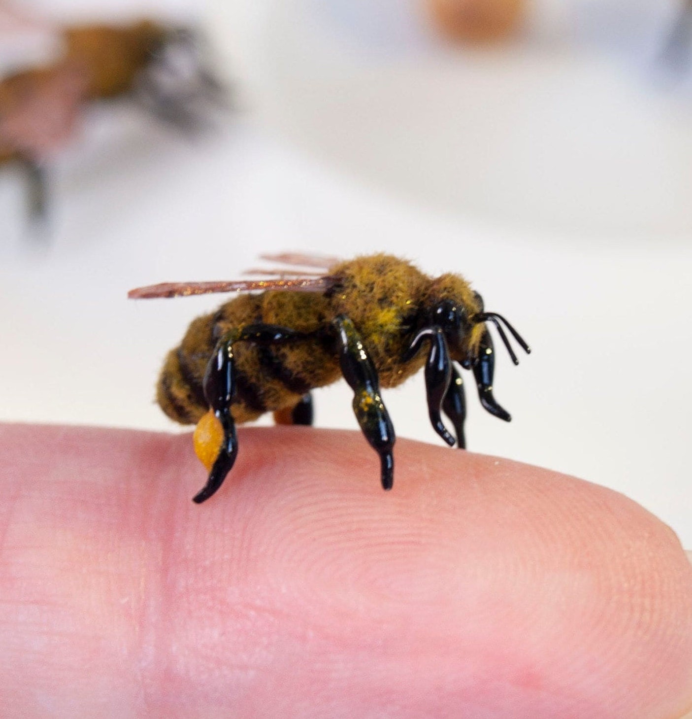 Realistic bee decor, busy honeybee miniature figurine, plant