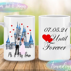 May include: Two white mugs with a wedding theme. One mug features a cartoon illustration of a bride and groom in front of a blue and gray castle with red hearts. The text on the mug reads "Mr. & Mrs. Romeo". The other mug has the date "07.05.21" and the text "Until Forever" with two red hearts.