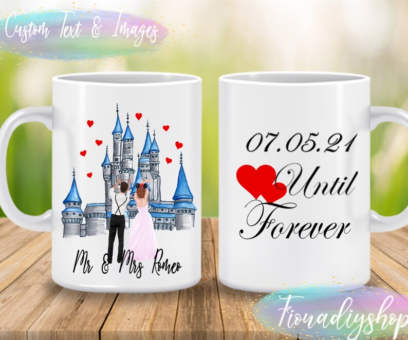 May include: Two white mugs with a wedding theme. One mug features a cartoon illustration of a bride and groom in front of a blue and gray castle with red hearts. The text on the mug reads "Mr. & Mrs. Romeo". The other mug has the date "07.05.21" and the text "Until Forever" with two red hearts.