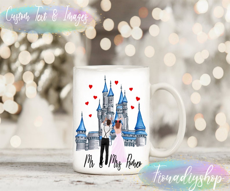 May include: White ceramic mug with a watercolor illustration of a couple standing in front of a blue and gray castle with red hearts floating above them. The text "Mr. & Mrs. Romeo" is printed on the bottom of the mug.