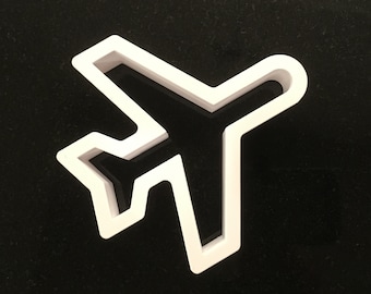 May include: White plastic airplane cookie cutter.