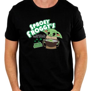 Design ispirato a Grogu di The Mandalorian, con il logo della scatola di cereali "Spacey Froggy's" su una maglietta.