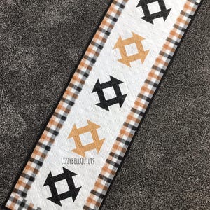 New! Quilted Table Runner, Black and Tan Fabric, With a Plaid Boarder, The White Background Fabric Shows off the Beautiful Quilting