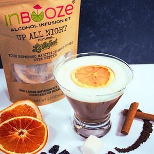 May include: An "InBooze" alcohol infusion kit for espresso martinis, with the text "Up All Night". The image shows a cocktail with a dried orange slice, cinnamon sticks, and dried fruit. The kit is 2.3 oz.