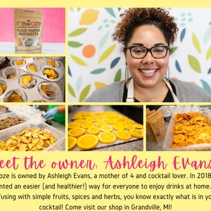 May include: A woman smiles at the camera while holding a bag of InBooze Blood Orange Margarita alcohol infusion kit. The image also shows dried fruit slices, likely used in the infusion kit.