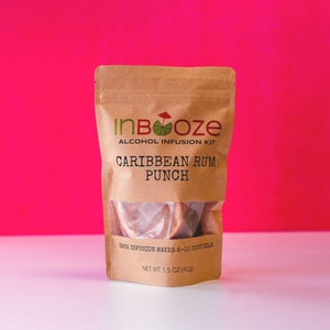 May include: A brown paper pouch with a label that reads "InBooze Alcohol Infusion Kit Caribbean Rum Punch". The pouch contains a clear plastic bag with dried fruit inside. The pouch is sitting on a white surface in front of a bright pink background. Each infusion makes 8-10 cocktails. Net weight 1.5 oz (42g).