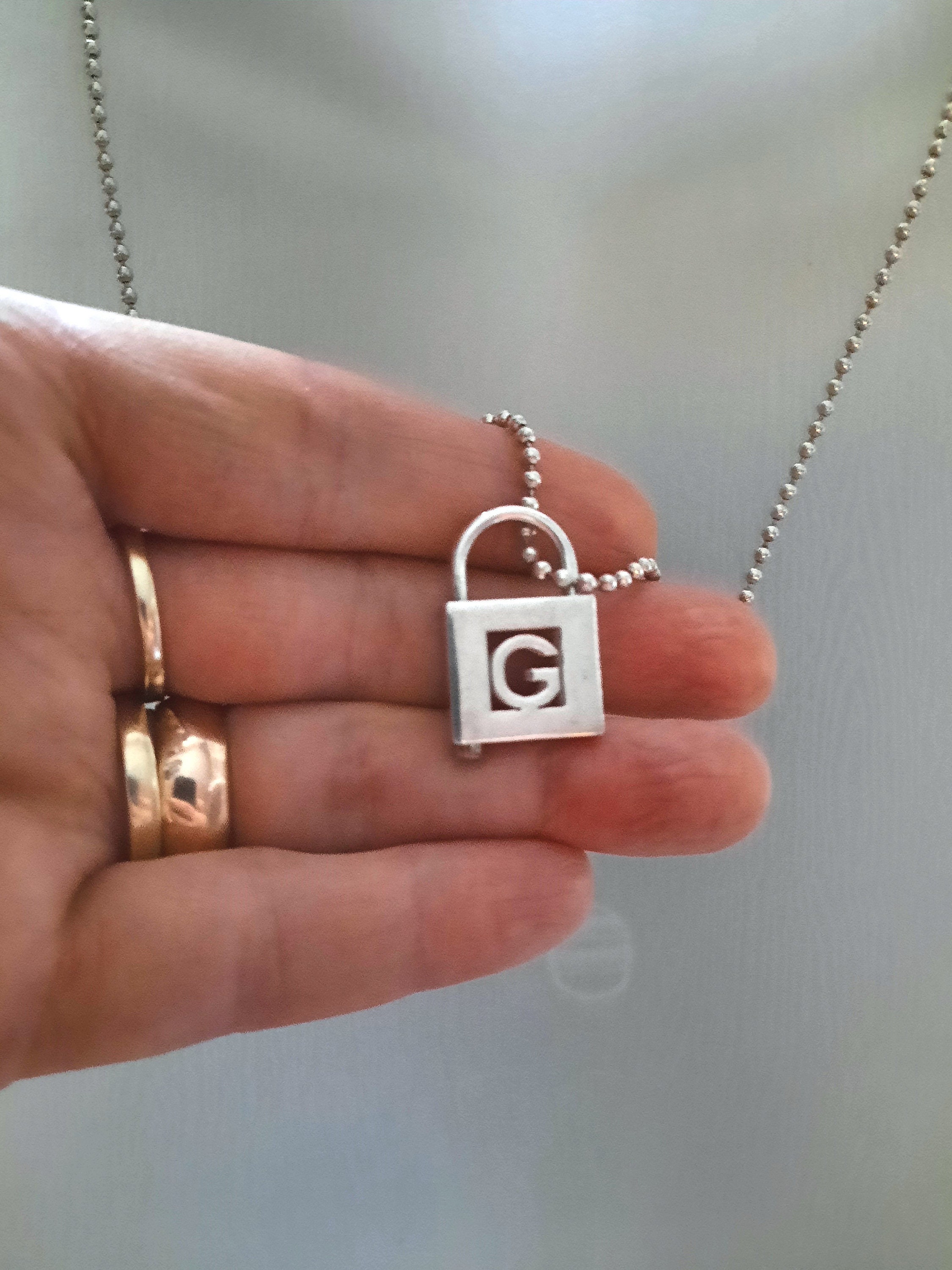 Tiffany letter shop g necklace