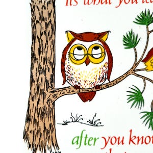 May include: A cartoon owl with red and yellow feathers and glasses sits on a branch of a tree. The text "It's what you learn after you know it all" is written below the owl.