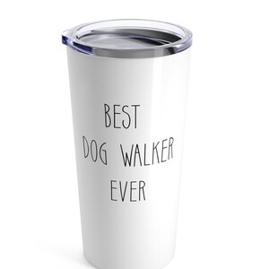 May include: White stainless steel travel mug with a black lid and the text "BEST DOG WALKER EVER" printed on the side.
