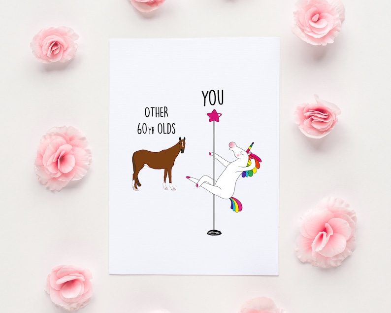May include: A white card with a humorous illustration comparing a unicorn doing a pole dance to a horse. The text on the card reads "You" above the unicorn and "Other 60 yr olds" above the horse.