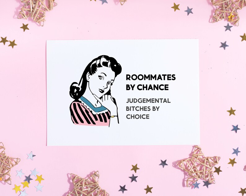 May include: A white card with a black and white illustration of a woman with a pink and black striped shirt. The text on the card reads "Roommates by chance, Judgemental Bitches by choice."