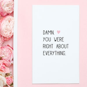 Puede incluir: Una tarjeta blanca con el texto "DAMN. YOU WERE RIGHT ABOUT EVERYTHING." y un peque&ntilde;o coraz&oacute;n rosa.
