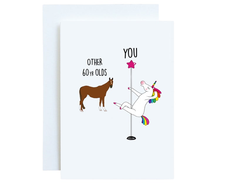 May include: A greeting card with a white unicorn holding a pole with a pink star on top. The unicorn has a rainbow mane and tail. The text on the card reads "YOU" above the unicorn and "OTHER 60 YR OLDS" next to a brown horse.