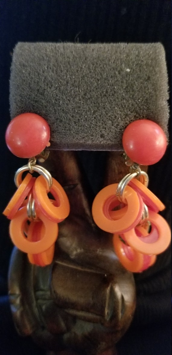 Vintage Plastic Red and Orange Circled Clips