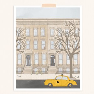 May include: A yellow taxi cab with a black stripe and the word "TAXI" on the side is parked in front of a beige brownstone building with two trees in front of it. The building has multiple windows and a set of stairs leading up to the front door.