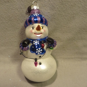 Vintage Celebrations by Radko Blown Glass Christmas Ornament - Snowman Holding a String of Lights