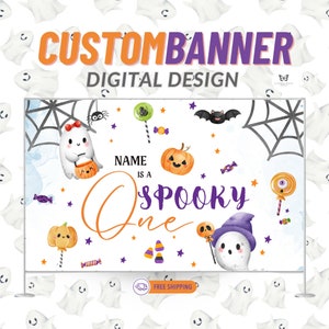 May include: A white banner with a Halloween theme. It features a ghost holding a pumpkin, a ghost with a witch's hat, and the text "NAME IS A SPOOKY ONE".