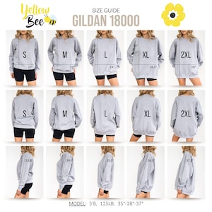 May include: Size guide for Gildan 18000 sweatshirts. The guide shows the measurements for sizes S, M, L, XL, and 2XL. The model is 5'8" tall and weighs 125 lbs. The model's measurements are 35"-28"-37". The sweatshirts are gray.