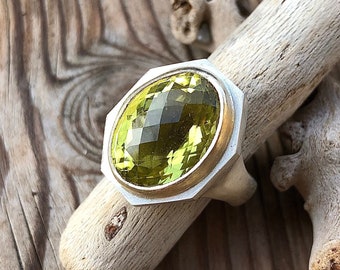 Ring, silver with oval lemon quartz (lemon citrine), bezel 585 (14k) gold