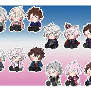 May include: Set of ten plush character figures. The figures are all in a sitting position and have different colored hair, clothing, and accessories. The figures are all smiling and have large eyes.