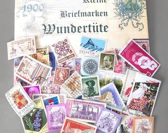 Vintage stamp collection of 250 used international postage stamps, paper ephemera for collage, scrapbooking, and craft supplies