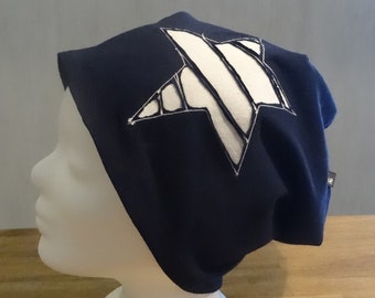 Reversible hat, beanie with negative star application