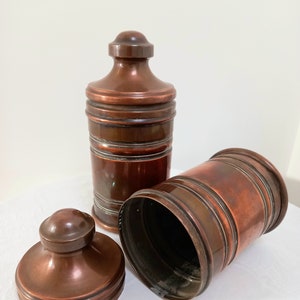 Antique copper canisters in arts and crafts style