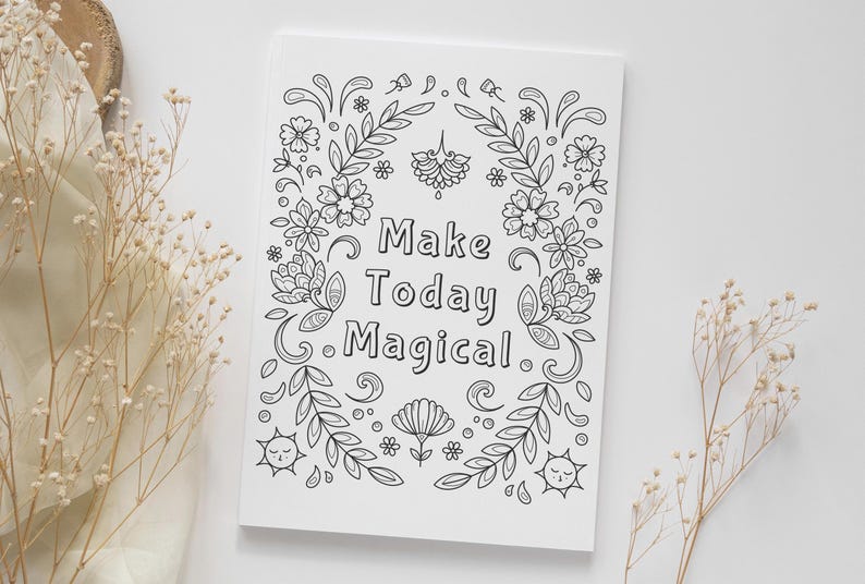 May include: A black and white printable coloring page with a floral border and the text "Make Today Magical".